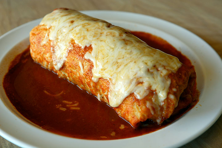 Cheese burrito, with extra cheese and fresh ingredients.