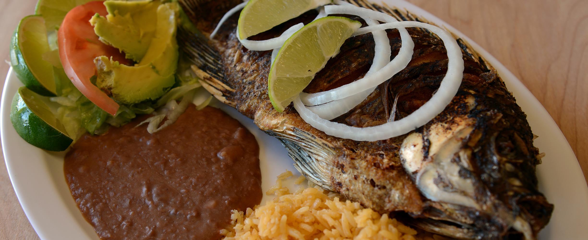 Fried whole fish, a typical Mexican and Salvadoran seafood dish using traditional recipes.